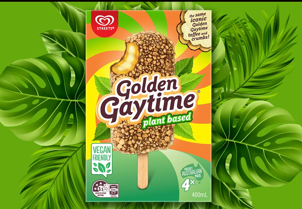 A box of plant-based Golden Gaytime ice creams on a background of green monstera. 