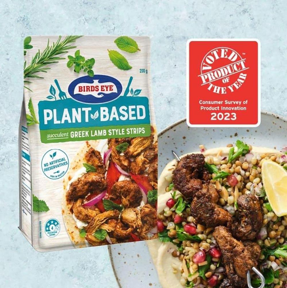 Birds Eye plant-based lamb skewers on a plate, with the product packaging to the side. 