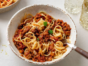 Overhead view of a bowl of spaghetti Bolognese made with TVP.