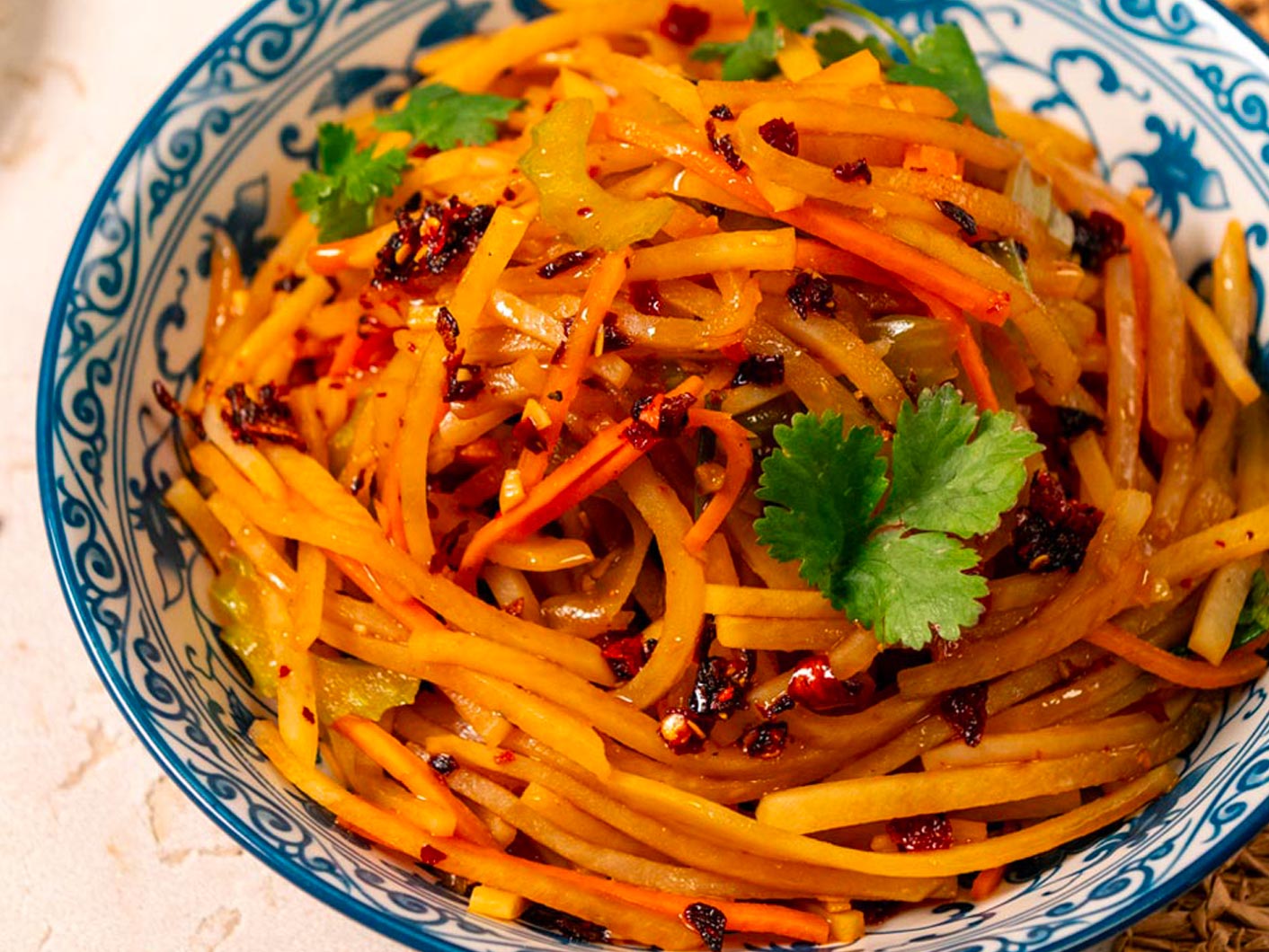 A close-up view of a shredded potato stir-fry.