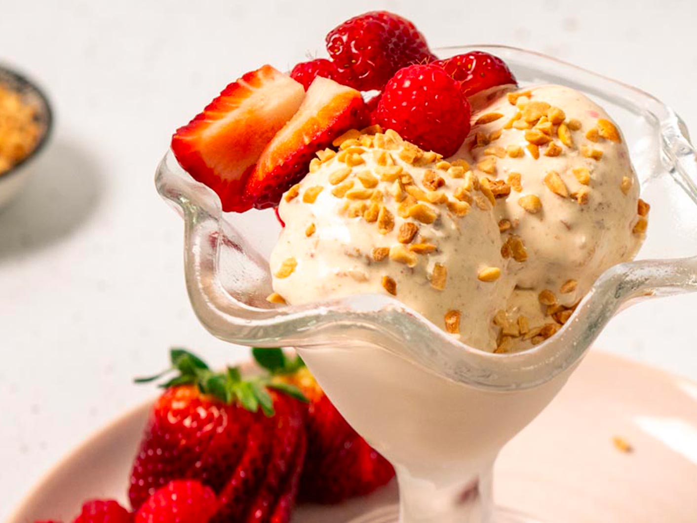 Close up of an indulgent vegan Biscoff Soft Serve with Peanut and Raspberry