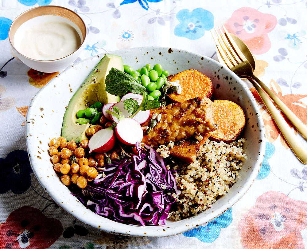 A Soul Bowl with purple cabbage, chickpea, avocado, quinoa, sweet potato, and marinated tempeh.