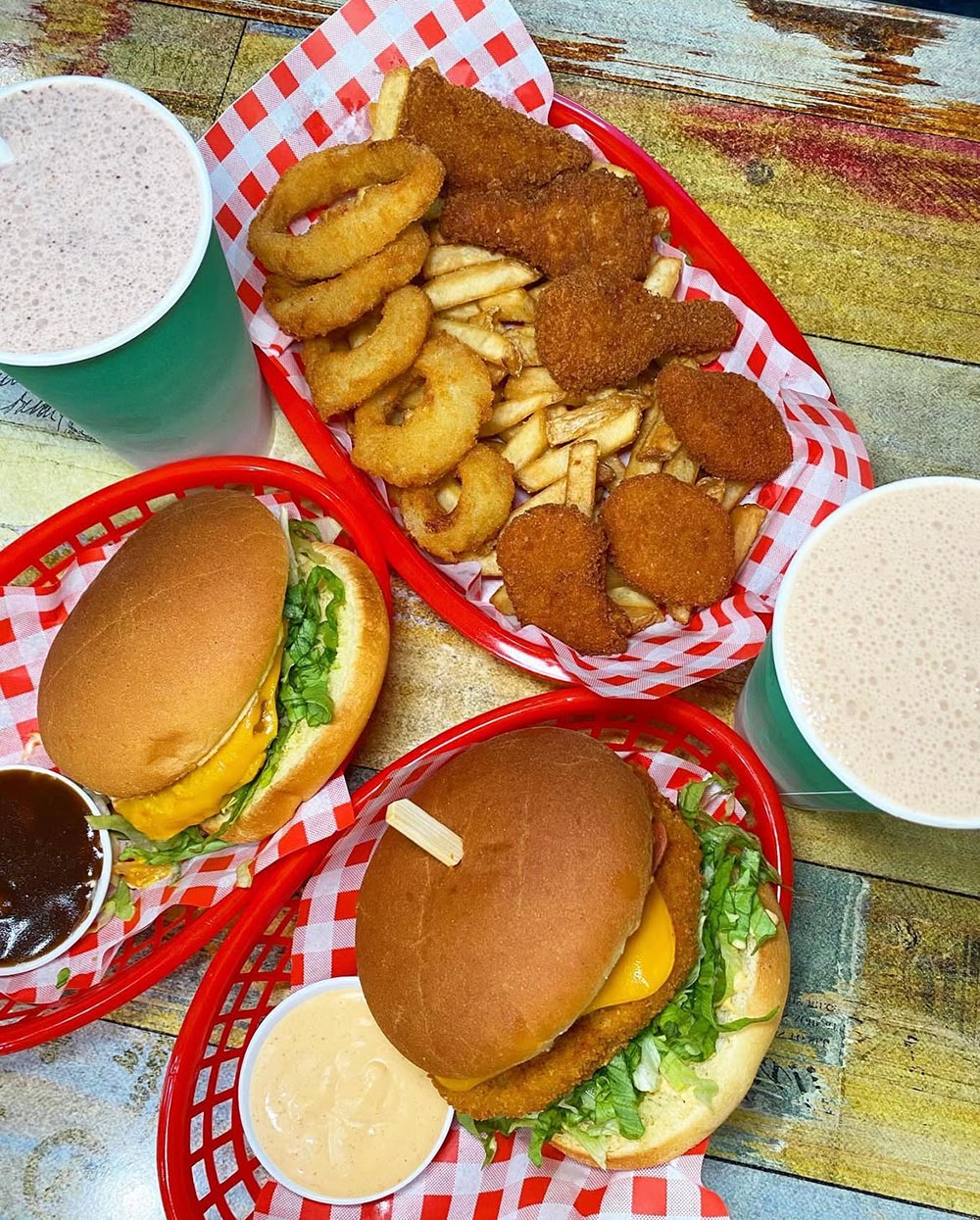 A mouth-watering spread of vegan burgers, fries, onion rings, nuggets and milkshakes from Lord of the Fries.