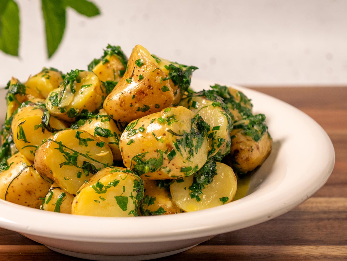 A close up image of buttery looking Irish minted potatoes.