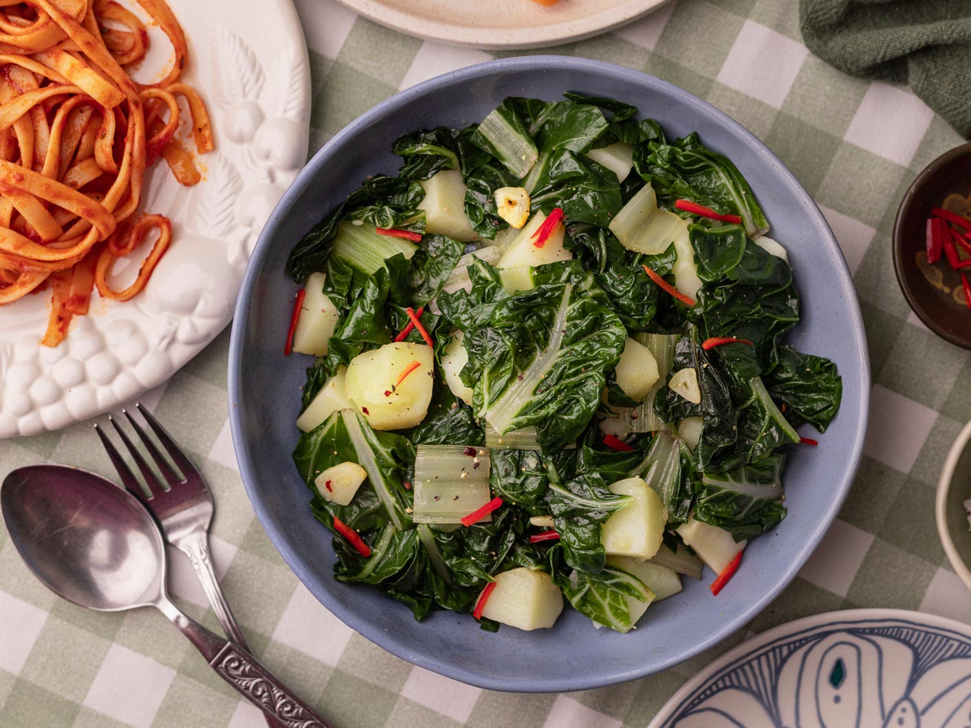 A bowl of sauteed potato and silverbeet