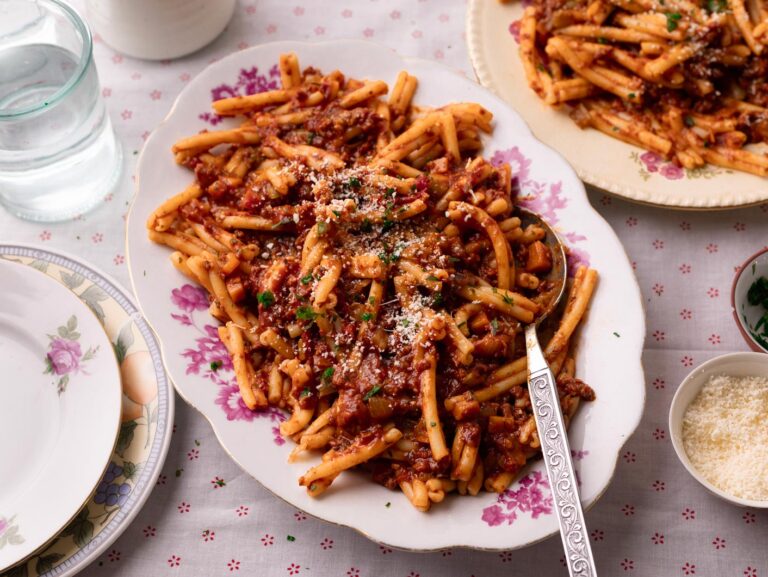 A big serving plate of Nanna's Bolognese served over casarecce pasta.