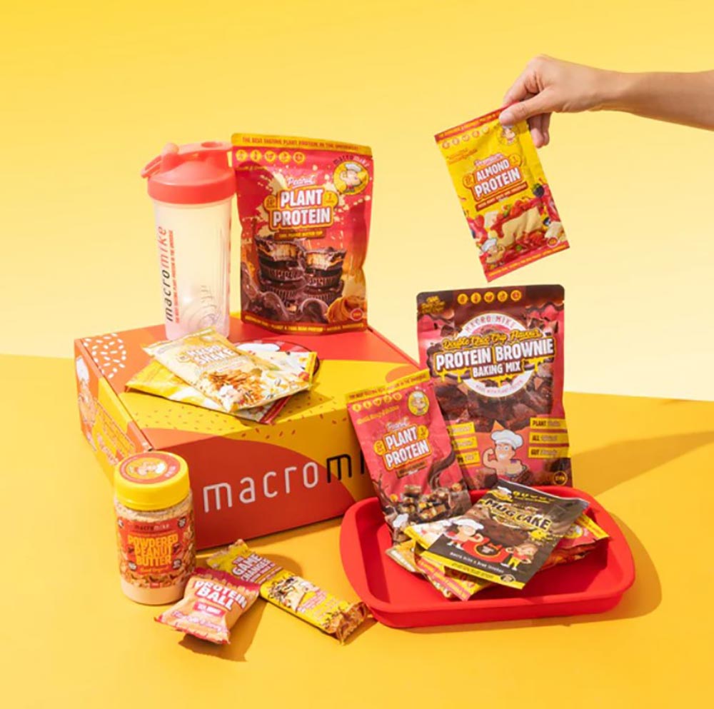 A range of Macro Mike vegan protein products displayed on a yellow background.